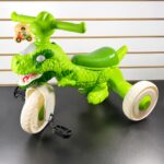 TRICICLO DINOSAURIO CON LUCES Y MUSICA 45CM ALTO X 55 LARGO